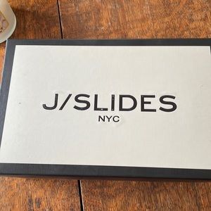 Size 9, J slides with stretch top & glitter detail at the toe.